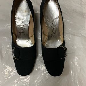 Naturalizer women dress low heel pump in black. Top is upholstered taffeta.